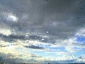 Raindrops on the glass against the blue sky Royalty Free Stock Photo