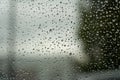 Raindrops on the glass as a background. Autumn concept.