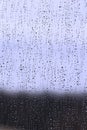 Raindrops on glass on cloudy dreaming day Royalty Free Stock Photo