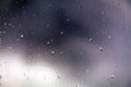 Raindrops on glass in cloudy weather Royalty Free Stock Photo