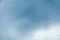 Raindrops on glass in cloudy weather Royalty Free Stock Photo