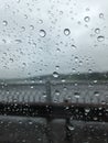 Raindrops on the glass in the foreground. Figured fence of the b Royalty Free Stock Photo