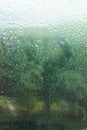 Raindrops on glass during rain, large drops