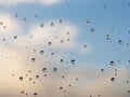 raindrops on glass sky texture. Pure blue fresh clean. Window view background screensaver. Place for text banner. Royalty Free Stock Photo