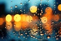 Raindrops on a glass window on a blurred bokeh city traffic lights background Royalty Free Stock Photo