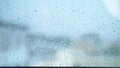 Raindrops on glass window with city view. blur, copy space Royalty Free Stock Photo