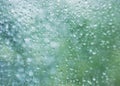 Raindrops on glass window texture background rain season