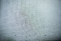 Raindrops on a mosquito net. Mosquito net on a window with a curtain. Horizontal photo, macro Royalty Free Stock Photo