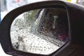 Raindrops outside the car in a raining day at road. side view from the car Royalty Free Stock Photo