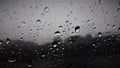 Raindrops over glass mirror of car Royalty Free Stock Photo