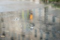 Raindrops over the surface. Bubbles in a rain puddle, Rain in the city Royalty Free Stock Photo