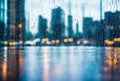 Raindrops patterning against a windowpane, creating a blurred cityscape beyond, offering a moment of reflection amid the