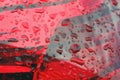 raindrops on red lanterns, car feet close up Royalty Free Stock Photo