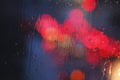 Raindrops and red lights Royalty Free Stock Photo