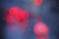 Raindrops and red lights Royalty Free Stock Photo