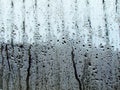 Raindrops texture on the glass window in the room. Outside the w Royalty Free Stock Photo