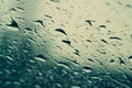 Raindrops on the window close up. rain drops on the glass macro. water drops falling down on window. rainy day Royalty Free Stock Photo