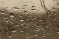 Raindrops on the window close up. rain drops on the glass macro. water drops falling down on window. rainy day Royalty Free Stock Photo