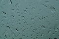 Raindrops on the window close up. rain drops on the glass macro. water drops falling down on window. rainy day Royalty Free Stock Photo