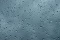 Raindrops on the window close up. rain drops on the glass macro. water drops falling down on window. rainy day Royalty Free Stock Photo