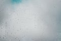 Raindrops on window in cloudy rainy weather. Perspective view, selective soft focus Royalty Free Stock Photo