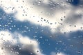 Raindrops on window cloudy sky