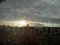 raindrops on window with dark sky