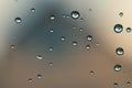 Raindrops on window glass close up. water drops abstract macro background Royalty Free Stock Photo