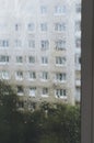 Raindrops on window glass, rainy day, looking trough window. Royalty Free Stock Photo