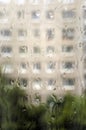 Raindrops on window glass, rainy day, looking trough window. Vertical photography Royalty Free Stock Photo