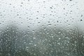 Raindrops on Window Glass Water Background Texture sky cloud at rainy day blur light gray rainy day Royalty Free Stock Photo