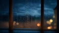 Raindrops on the window at night. Shallow depth of field. city park bokeh background