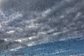 Raindrops on a window pane on the background of a stormy sky Royalty Free Stock Photo