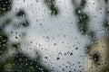 Raindrops on window pane. Blurred background outside the window in the rain Royalty Free Stock Photo