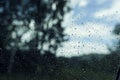 raindrops on the window pane, clouds behind the glass, raining Royalty Free Stock Photo