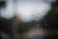 raindrops on a window. Rainy window at night. dark blue wet, drops of water rain on glass background. concept of autumn weather Royalty Free Stock Photo