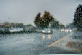 Raindrops on the windshield while driving on a rainy day during fall season, California Royalty Free Stock Photo