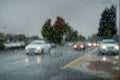 Raindrops on the windshield while driving on a rainy day during fall season, California Royalty Free Stock Photo