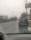 Raindrops on the windshield. View from inside the car