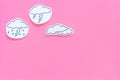 Rainfall forecast concept. Weather icons. Rainy cloud, lightening on pink background top view copy space