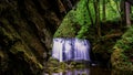 Washington State waterfall with mossy rocks and old rock bridge