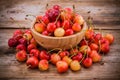 Rainier ÃÂherries in a bowl on wooden background Royalty Free Stock Photo