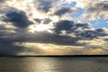 The raining clouds and the ocean at sunset