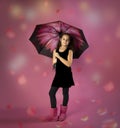 Raining flower petals on girl with umbrella