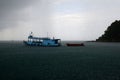 Raining over boat at the sea