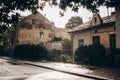 Raining in sunny light in street. rain drops in sunshine at cou Royalty Free Stock Photo