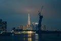 Raining view of skyline with landmark 81 skyscraper, a new cable-stayed bridge is building connecting Thu Thiem peninsula and Royalty Free Stock Photo