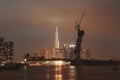 Raining view of skyline with landmark 81 skyscraper, a new cable-stayed bridge is building connecting Thu Thiem peninsula and Royalty Free Stock Photo