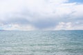 rainstorm in distance while at namtso lake in tibet Royalty Free Stock Photo