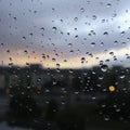 Rainstorm Reflections Water Drops and Stormy Skies Through a Window Royalty Free Stock Photo